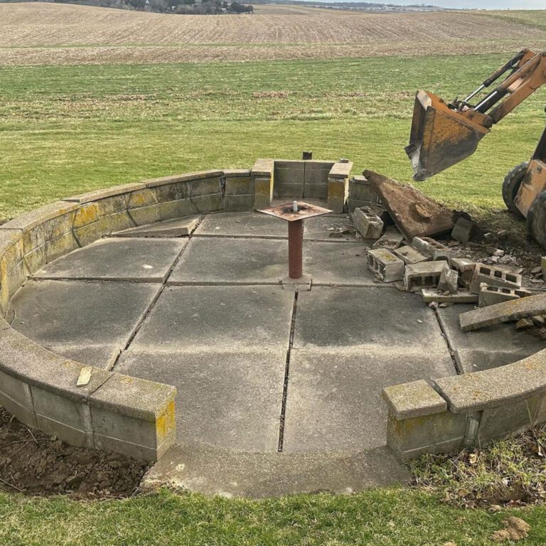 The before image of a patio being built, with demolition havign just begun on the old patio.